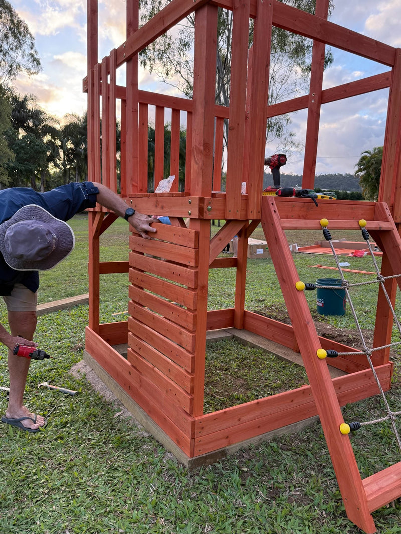 Matilda Fort children's play tent with neutral canvas fabric and wooden frame, styled in a bright, minimalist room setting