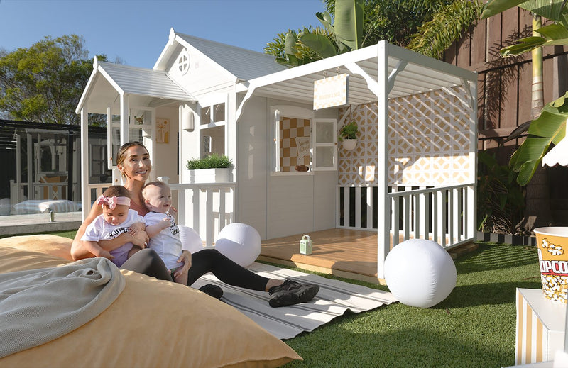 My Little Manor wooden cubby house with pitched roof and window, outdoor playhouse for kids available at Hide and Seek Kids