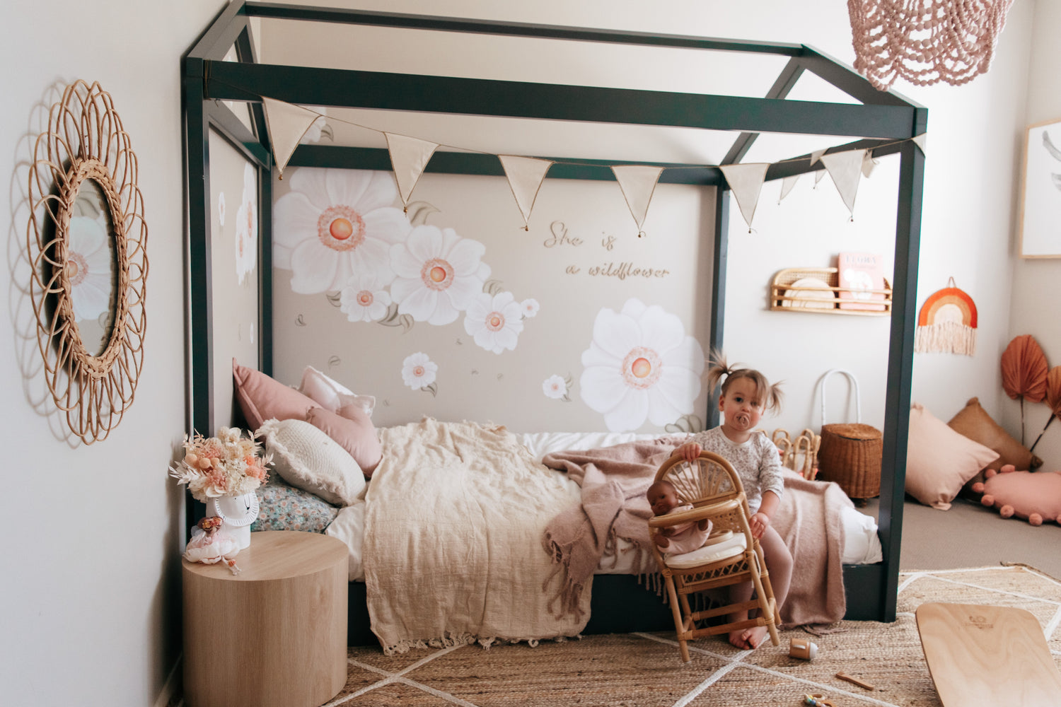 Cubby House Montessori floor bed setup in little girls bedroom.