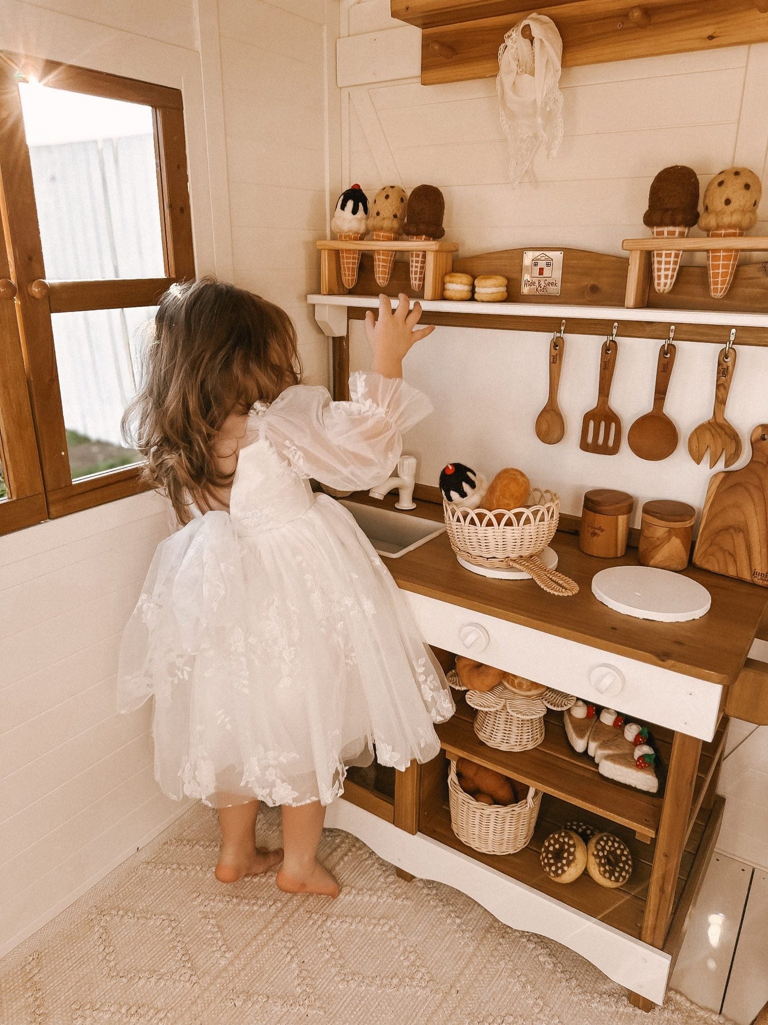 Mud Kitchen from Hide and Seek Kids featuring natural timber construction