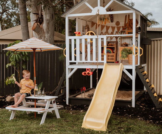 Children's Kidz Shack Cubby wooden playhouse photographed outdoors with natural lighting in backyard setting