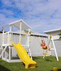 Little girl on swing, on the matilda play fort. setup in the backyard.