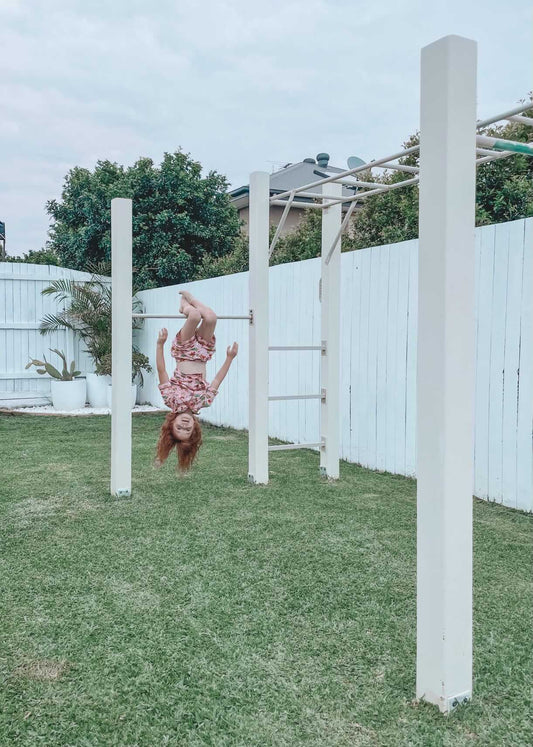 Monkey bars outdoor playground equipment with child demonstrating climbing, durable kids play structure