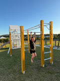 Monkey bars playground equipment with child playing outdoors, durable climbing frame for active kids