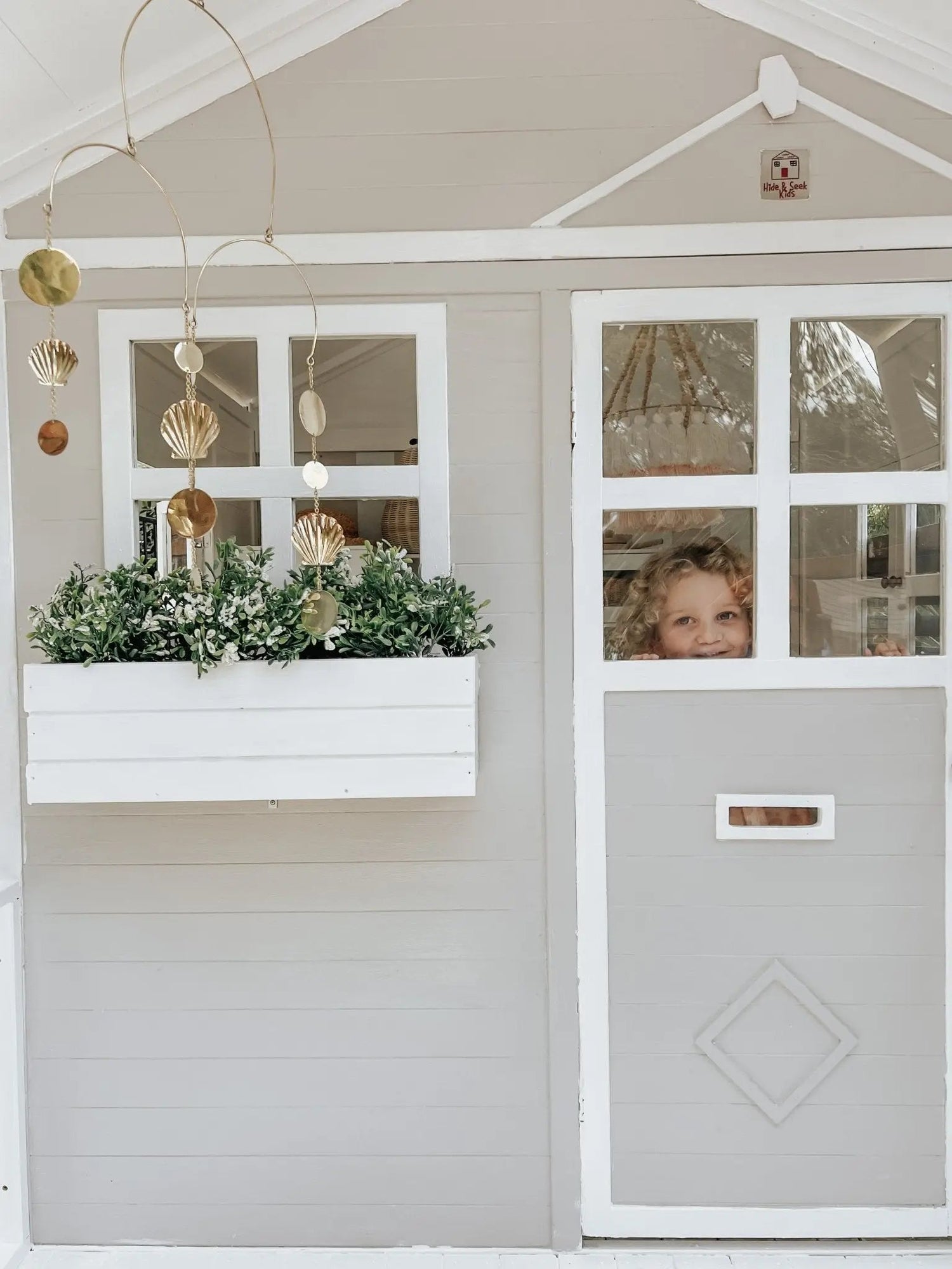 Millie Cubby House outdoors in winter — timber kids playhouse showing weathered natural finish through Australian seasons