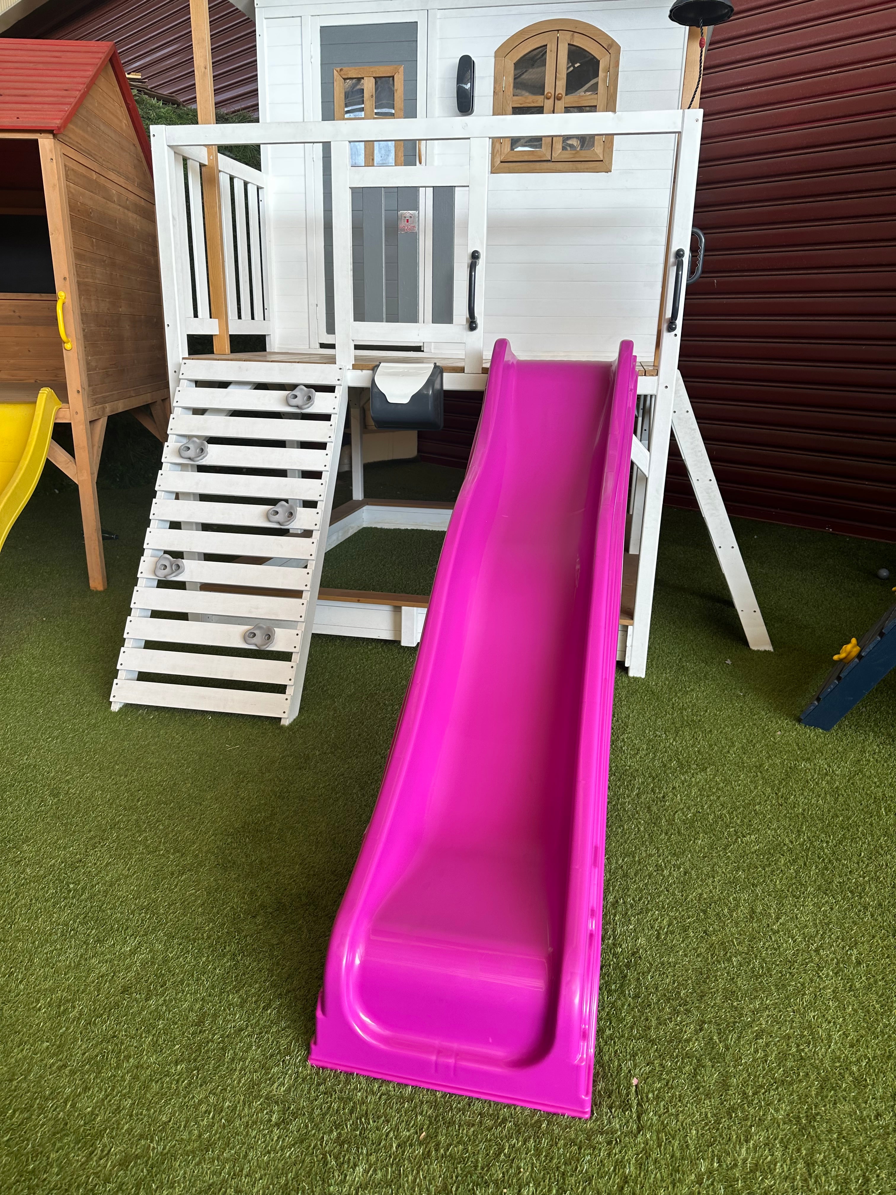 Plastic cubby best sale house with slide