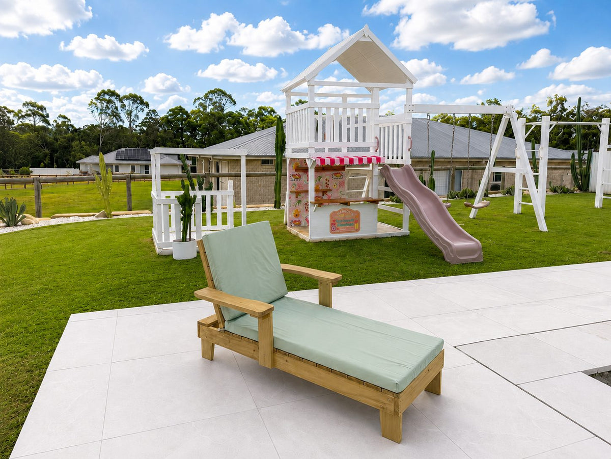 Hide and Seek Kids timber sun lounger with pale cushion, three-quarter front view