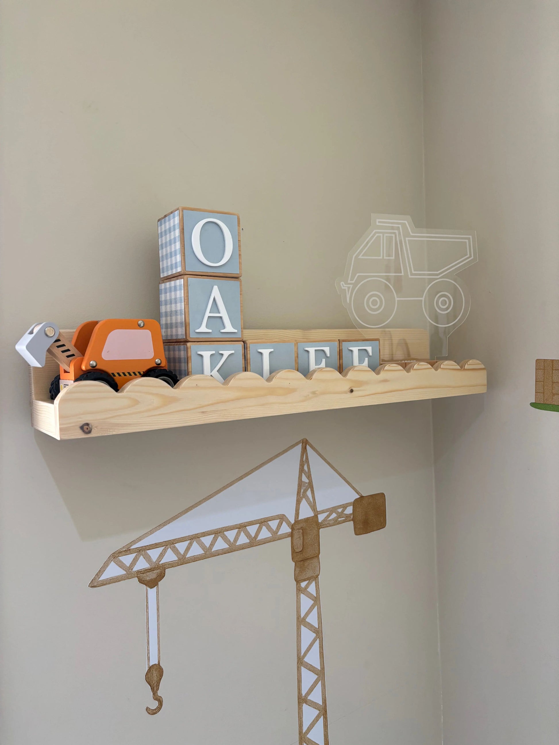 Lulu Scalloped Wall Shelf installed as a flat shelf with streamlined profile