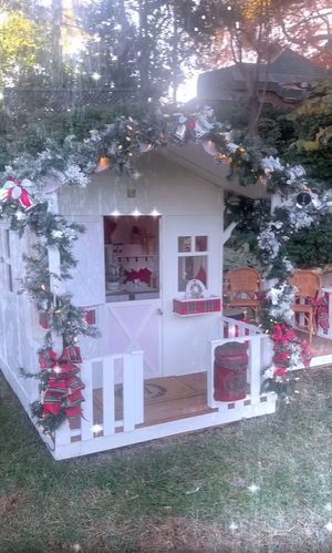 Kathy Hilton decorating a Hide & Seek Kids cubby house for the holidays with family.