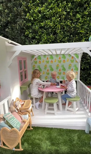 Tessa Hilton with Hide & Seek Kids cubby house, sharing a magical backyard playhouse for her family.
